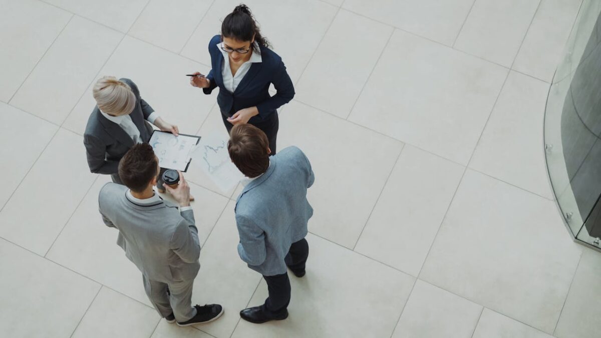 Group of business professionals collaborating in an office setting.